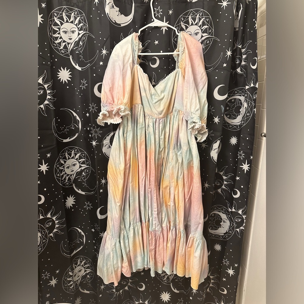 Selkie dopamine midi dress with short puff sleeves and square neckline.